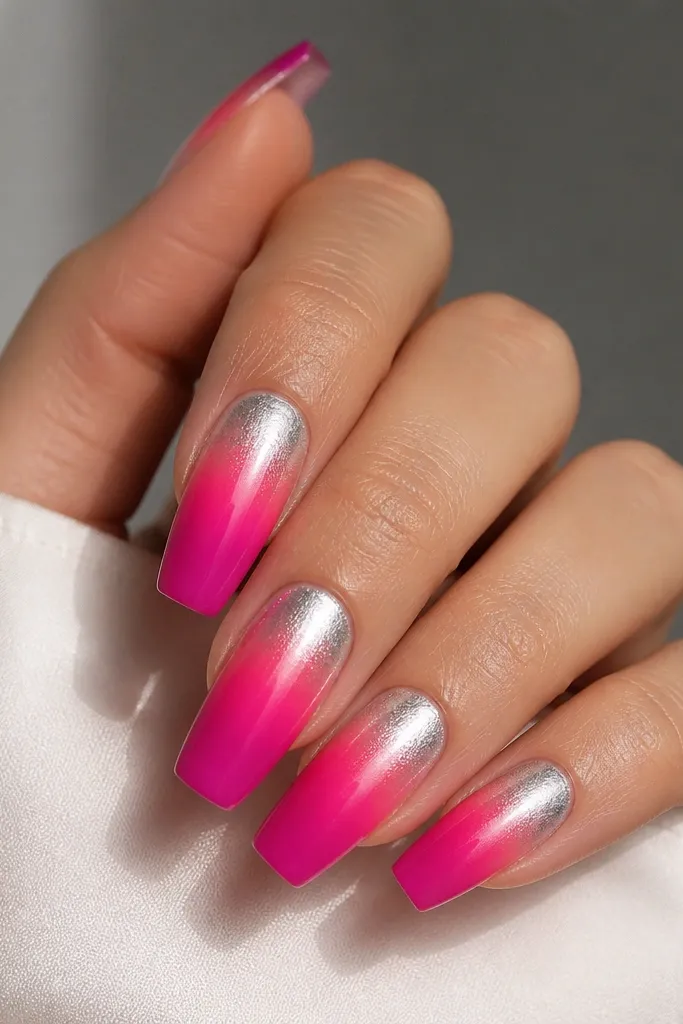 Medium coffin nails with hot pink fading into fuchsia at the tip; silver chrome starts near the cuticle and fades out before the mid-nail.