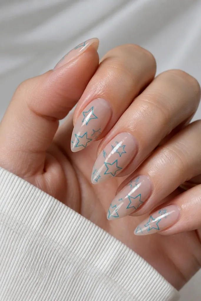 Short stiletto nails with a clear jelly base. Thin teal line art stars sit on the sides of each nail, with one larger star near the free edge. Glossy.