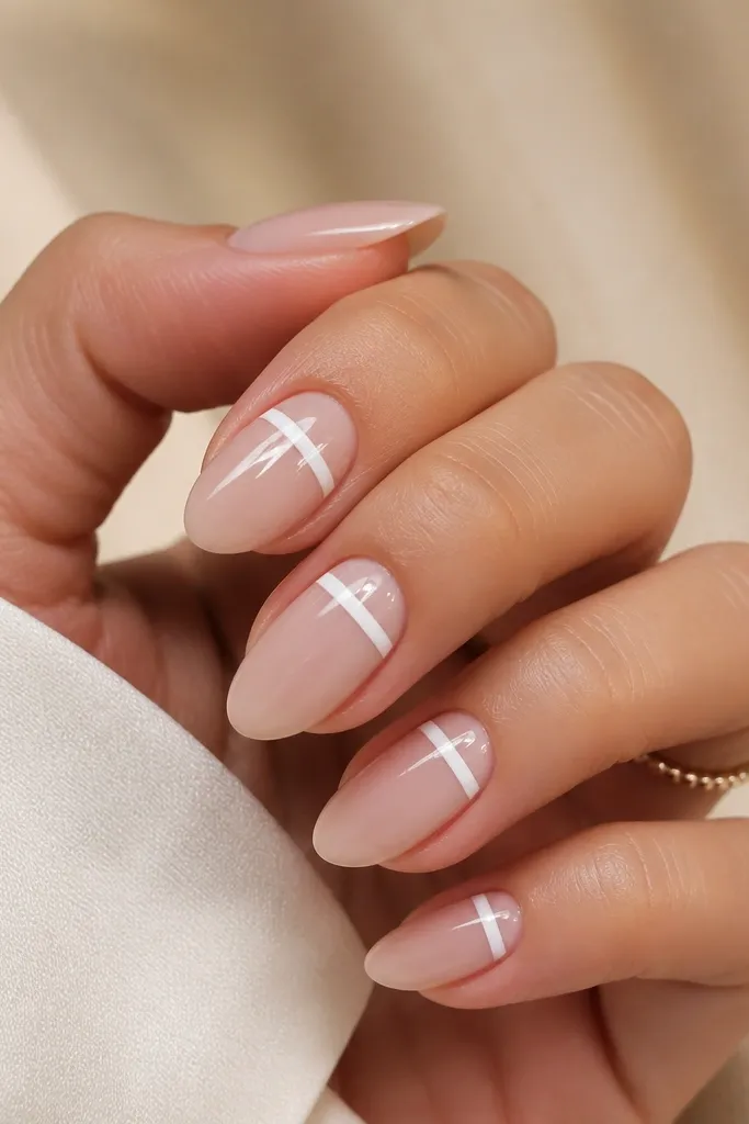Short nails with nude bases. A white line runs across the top third of the nail horizontally, stopping short of the sidewalls. Glossy finish.