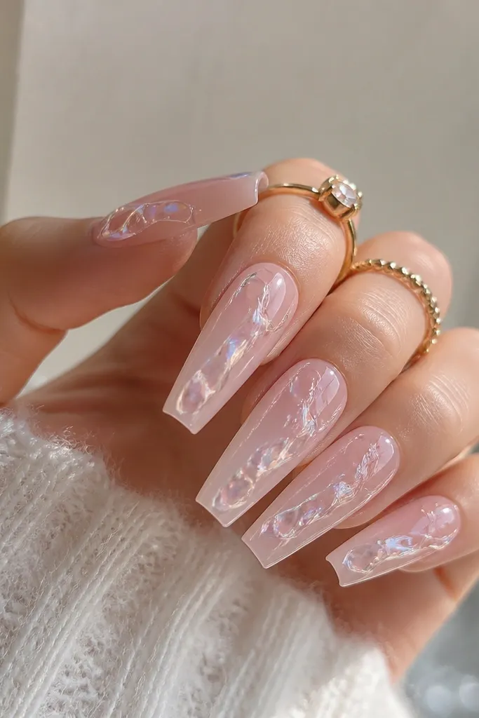 Coffin nails in pale rose pink with clear gel sections that look like ice pockets; glossy and dimensional.