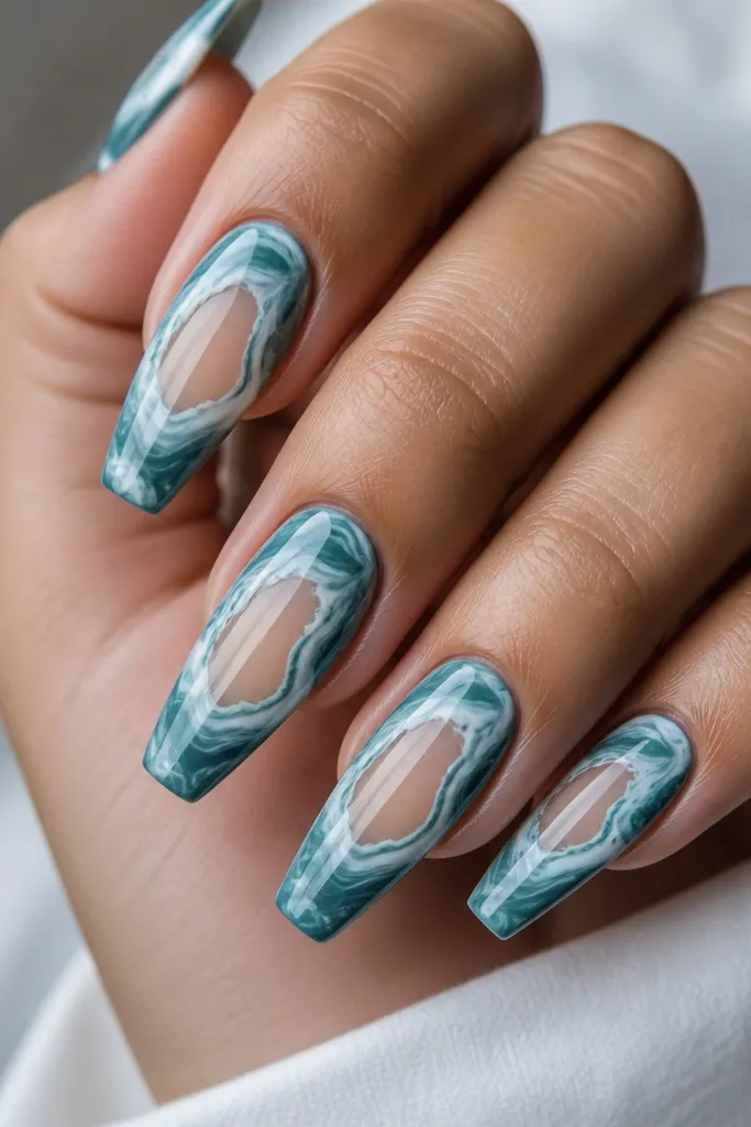 Teal and white marble coffin nails, with a clear window near the center of each nail showing the natural nail or clear gel. Marble swirls wrap around the window edges.