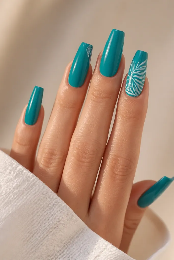 Coffin nails painted Caribbean teal with glossy finish. On accent nails, white palm tree outlines stretch vertically from mid-nail to tip. The outlines are thin and clean, no fill.