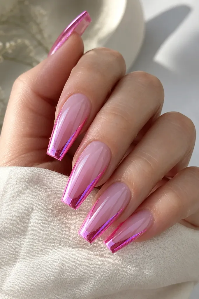 Medium coffin nails fading from sheer lilac at the base to deeper lilac at the tip. Magenta chrome is mirror, with pink glow spark borders tracing both side edges and a little at the tip.